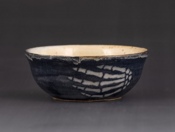 Bowl with skeleton hand design by Adriana Ghizila