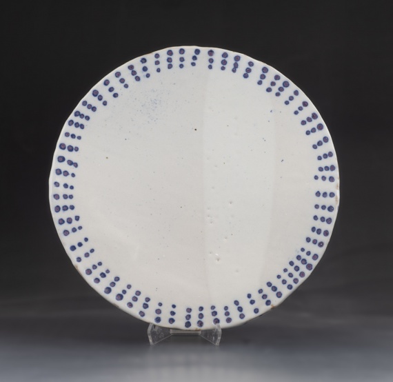 White platter with blue dotted rim by Alexa Mendizabal