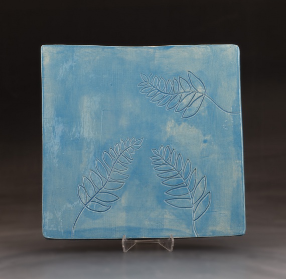 Blue tray with leaf design by Anna Jossart