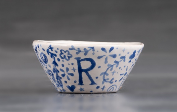 Miniature white bowl with blue design by Rowen Wintermute