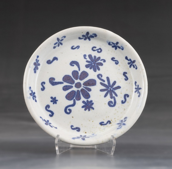 White plate with blue overfglaze design by Yana-Maria Deneva