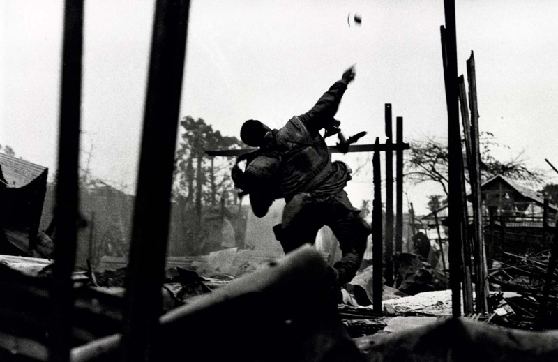 <p><b>Don McCullin</b>, <i>U.S. Marine throwing a hand grenade during the Têt offensive, Battle of Hué, Vietnam, February 1968</i>.</p>