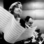 <p><b>Eve Arnold</b>, <i>USA. New York City. Marlene DIETRICH at the recording studios of COLUMBIA RECORDS, who were releasing most of her songs she had performed for the troops during World War II, including LILI MARLENE, Miss Otis Regrets.She was 51 years old and starting a come-back in show business.It was a wet and cold November night and work could only begin at midnight, at the advise of Marlene's astrologer</i>, November 1952, © Eve Arnold/Magnum Photos</p>