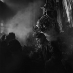 <p><b>John Gutmann</b>, <i>Beneath a Giant Guardian the Fortune Teller, Yunnan Province, China</i>.</p>