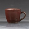Oxblood cup with handle by Nina Atkinson