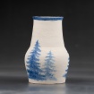 White vase with blue tree design by Sam Frank